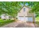A two car attached garage featuring two white doors at 10132 Caldwell Depot Rd, Cornelius, NC 28031