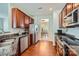 Well-equipped kitchen with granite countertops, stainless steel appliances, and hardwood floors at 10132 Caldwell Depot Rd, Cornelius, NC 28031
