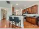 Charming kitchen features wood cabinetry, granite countertops, and stainless steel appliances at 10132 Caldwell Depot Rd, Cornelius, NC 28031