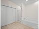 Bathroom with tile floor, corner tub, glass enclosed shower and double-door closet at 104 Mooreland Ne Dr, Conover, NC 28613