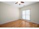 Bedroom featuring a ceiling fan, light-colored walls, and hardwood floors at 104 Mooreland Ne Dr, Conover, NC 28613