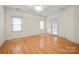 Spacious bedroom with wood floors and ample natural light from large windows and French doors at 104 Mooreland Ne Dr, Conover, NC 28613