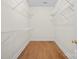 Walk-in closet featuring wood floor and wire shelving on three sides at 104 Mooreland Ne Dr, Conover, NC 28613
