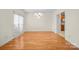 Dining room with wooden floors, chandelier, and a large window at 104 Mooreland Ne Dr, Conover, NC 28613