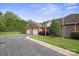 Brick home featuring an attached two car garage with a beautifully manicured lawn and driveway at 104 Mooreland Ne Dr, Conover, NC 28613