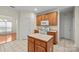 Functional kitchen with a center island, wooden cabinets, and white appliances at 104 Mooreland Ne Dr, Conover, NC 28613