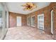 Sunroom featuring tiled floor, brick walls, multiple windows and access to the outside at 104 Mooreland Ne Dr, Conover, NC 28613