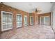 Bright sunroom with brick accent walls, tiled floor, and multiple windows for natural light at 104 Mooreland Ne Dr, Conover, NC 28613