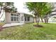 Well-maintained backyard showcasing a patio area, lush green lawn, and views of the surrounding landscape at 1040 Stonedown Ln, Matthews, NC 28104