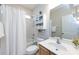 Bathroom with a tub shower, vanity, and mirror at 1040 Stonedown Ln, Matthews, NC 28104