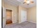 Bedroom features a ceiling fan, closet, and doorway that reveals an adjoining room at 1040 Stonedown Ln, Matthews, NC 28104