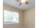 Comfortable bedroom with a ceiling fan and a window that brings in ample natural light at 1040 Stonedown Ln, Matthews, NC 28104