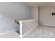 Open concept bonus room, newly carpeted, ready for decor with wall mount and plenty of electric outlets at 1040 Stonedown Ln, Matthews, NC 28104