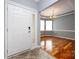 Inviting entry with hardwood flooring and a dining area with natural light at 1040 Stonedown Ln, Matthews, NC 28104
