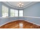 Bright dining area with hardwood floors, ample natural light from the large windows at 1040 Stonedown Ln, Matthews, NC 28104