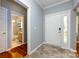 Inviting entryway featuring tile flooring and a view into the main-level bathroom at 1040 Stonedown Ln, Matthews, NC 28104