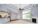 Spacious open-concept living room boasts high ceilings, large windows, fireplace, and hardwood floors at 1040 Stonedown Ln, Matthews, NC 28104