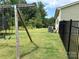 Expansive backyard showing the home's air conditioning unit and an installed swingset at 10417 Bluejack Oak Ct, Huntersville, NC 28078