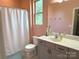 Charming bathroom features a shower with curtain, vanity, framed mirror and decorative decor at 10417 Bluejack Oak Ct, Huntersville, NC 28078