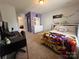 Cozy bedroom featuring plush carpet and a comfortable bed at 10417 Bluejack Oak Ct, Huntersville, NC 28078