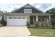 Charming single-Gathering home with a well-manicured lawn and inviting front porch at 10417 Bluejack Oak Ct, Huntersville, NC 28078