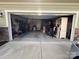 Large garage with plenty of storage space, door open to reveal the inside at 10417 Bluejack Oak Ct, Huntersville, NC 28078