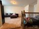 Loft area with comfortable leather seating, providing a versatile living space at 10417 Bluejack Oak Ct, Huntersville, NC 28078