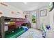 Whimsical ' bedroom featuring a bunk bed, colorful accents, playful decor, and a large window for ample natural light at 1101 Plaza Walk Dr, Charlotte, NC 28215