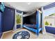 Themed bedroom featuring bunk beds, star-themed wall decor, plush carpet, and abundant natural light from two large windows at 1101 Plaza Walk Dr, Charlotte, NC 28215