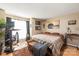 Comfortable bedroom with a modern desk, hardwood floors, and plenty of natural light at 11069 Running Ridge Rd, Charlotte, NC 28226