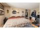 Cozy bedroom with warm tones, wood floors, a bed, and a creative workspace at 11069 Running Ridge Rd, Charlotte, NC 28226