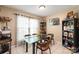 Inviting dining room with natural light, tile flooring, and a modern glass-top dining table at 11069 Running Ridge Rd, Charlotte, NC 28226