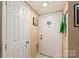 Bright entryway with tile flooring, white doors, and ample space for coats and shoes at 11069 Running Ridge Rd, Charlotte, NC 28226