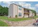 Inviting townhouse featuring a balcony, manicured lawn, and ample parking in a desirable neighborhood at 11069 Running Ridge Rd, Charlotte, NC 28226