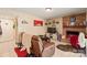 Spacious living room featuring a brick fireplace, tile floors, and comfortable seating at 11069 Running Ridge Rd, Charlotte, NC 28226