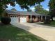 Traditional home featuring an attached two-car garage and a long driveway at 1116 Fieldstone Rd, Mooresville, NC 28115