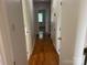 Hallway with hardwood floors offers seamless transition between rooms at 1116 Fieldstone Rd, Mooresville, NC 28115