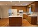 Functional kitchen offers wooden cabinetry, an island and modern appliances at 1116 Fieldstone Rd, Mooresville, NC 28115