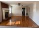 Bright living room featuring a traditional fireplace and hardwood floors at 1116 Fieldstone Rd, Mooresville, NC 28115