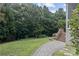The house has a beautiful backyard with lush landscaping and a walkway at 1119 Williamstown Rd, Matthews, NC 28105