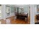 Elegant dining room featuring hardwood floors, wainscoting, and a chandelier at 1119 Williamstown Rd, Matthews, NC 28105
