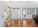Bright foyer with hardwood floors, large windows, and a view of the front door at 1119 Williamstown Rd, Matthews, NC 28105