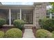 Beautiful brick home featuring a well-manicured front lawn and front entrance at 1119 Williamstown Rd, Matthews, NC 28105