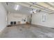Spacious two-car garage with high ceilings and room for storage on the floor at 1119 Williamstown Rd, Matthews, NC 28105
