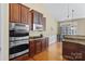 Open kitchen area with modern appliances, hardwood floors, and lots of cabinet space at 1119 Williamstown Rd, Matthews, NC 28105
