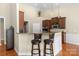 Bright kitchen with granite countertops, pendant lighting, and stainless steel microwave at 1119 Williamstown Rd, Matthews, NC 28105