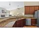 Well-lit kitchen with granite countertops, stainless steel appliances, and generous cabinet space at 1119 Williamstown Rd, Matthews, NC 28105