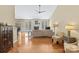 Open living room features a fireplace, hardwood floors, and natural light at 1119 Williamstown Rd, Matthews, NC 28105