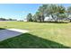 Large grassy backyard with mature trees at 11533 Valley Oak Ln, Stanfield, NC 28163