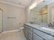 Bright bathroom featuring double vanity with granite countertop and modern fixtures at 11533 Valley Oak Ln, Stanfield, NC 28163